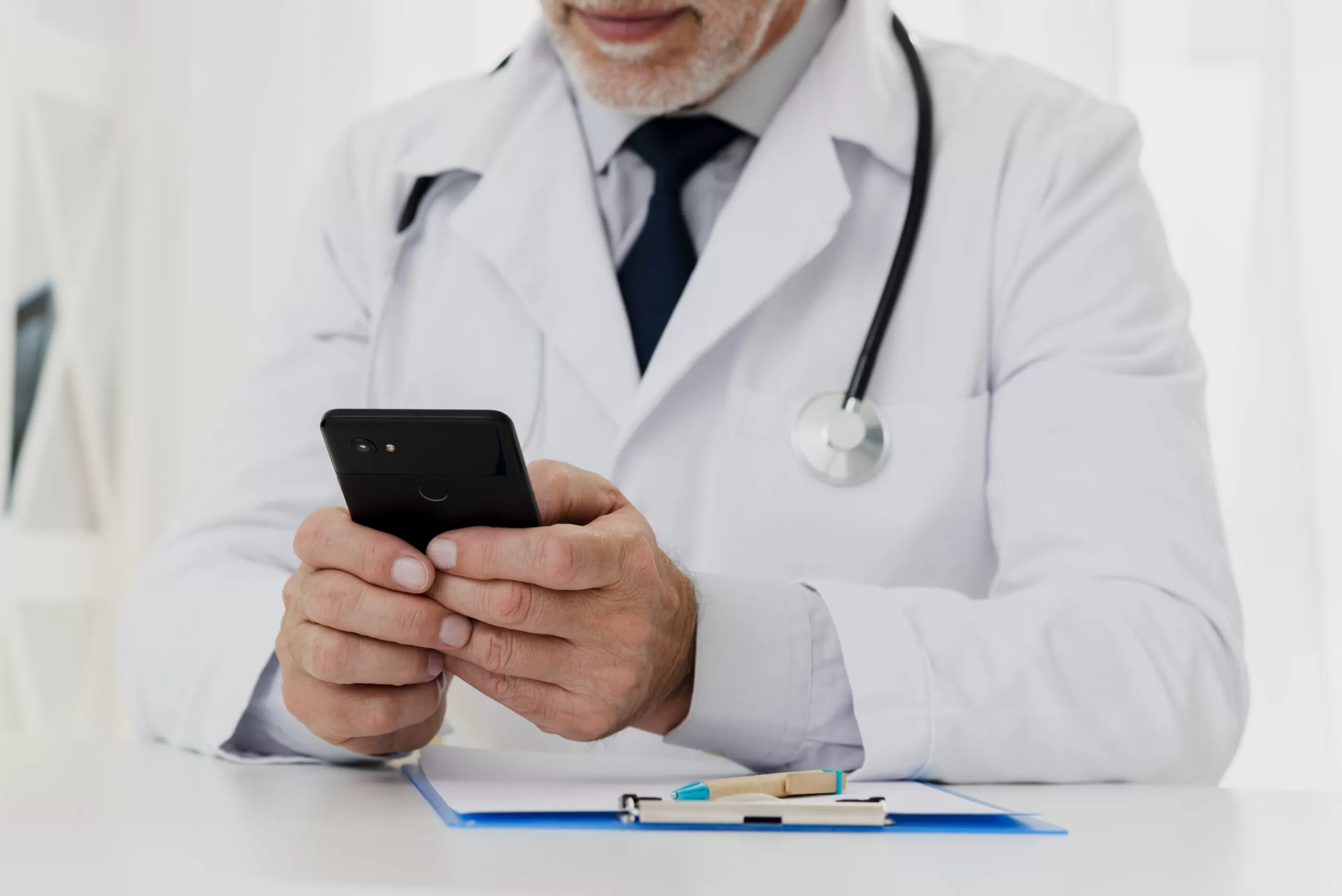 Doctor doing telemedicine on his phone